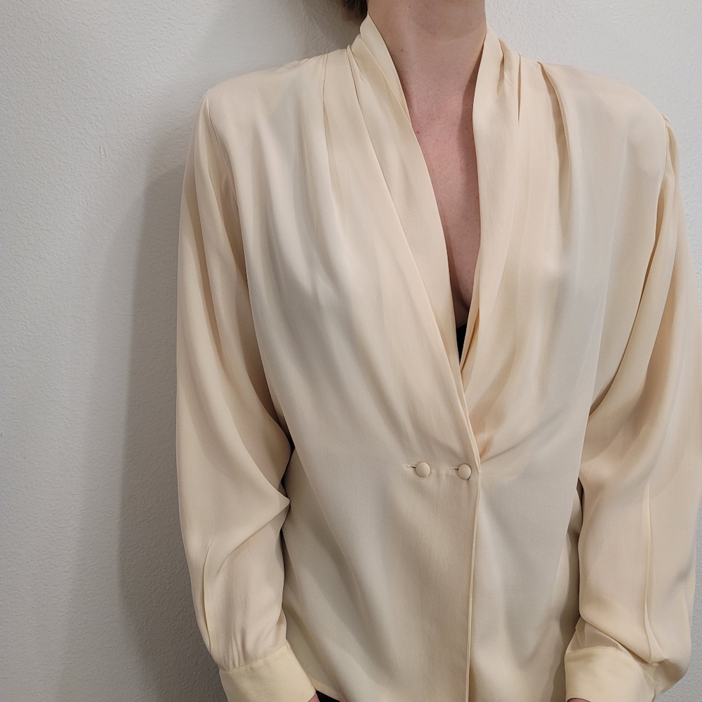 Ivory long-sleeve blouse with pleated shoulders